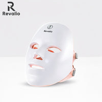 White LED face mask with Revalio branding on a light gray background