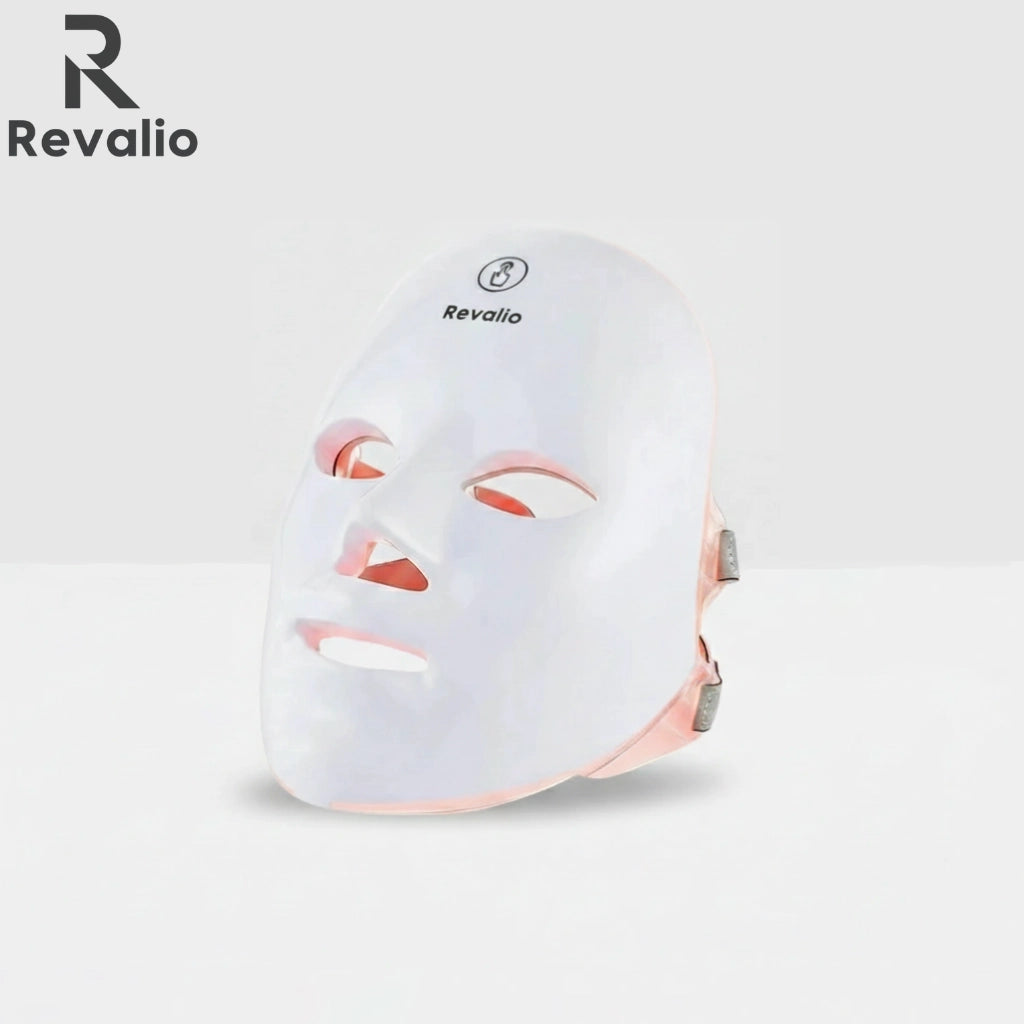 Revalio white LED face mask with Revalio branding on the top left corner on a light gray background