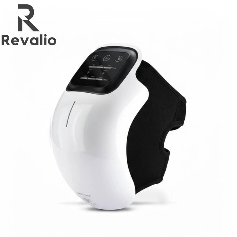 Front angled view of the Revalio Smart Knee Massager with white shell and black adjustable strap against a white background.